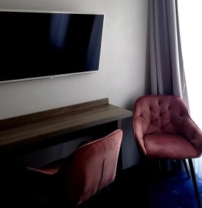 Televízia a/alebo spoločenská miestnosť v ubytovaní Willa Długa No. 4 Bed & Breakfast