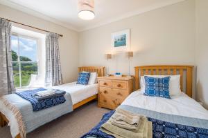 Ένα ή περισσότερα κρεβάτια σε δωμάτιο στο Goat Street Cottage