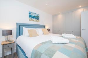 Ένα ή περισσότερα κρεβάτια σε δωμάτιο στο The Sail Loft