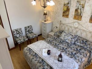 A bed or beds in a room at Casa turística ''Los chaleco'' en Lumbreras con terraza privada.