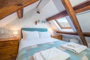 Postel nebo postele na pokoji v ubytování Barnacle Cottage