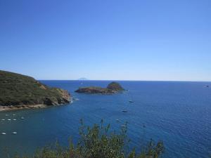 a large body of water with a group of islands at Appartamento Porto Azzurro 5/6 beds in Porto Azzurro