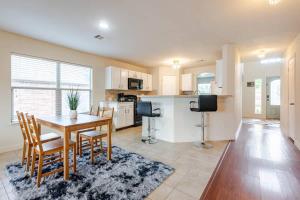 a kitchen and dining room with a table and chairs at Stunning 4-Bedroom Spacious 2-Story Home in Buda