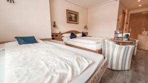 Posteľ alebo postele v izbe v ubytovaní Hotel Flora