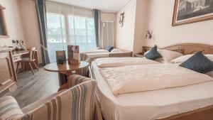 Posteľ alebo postele v izbe v ubytovaní Hotel Flora