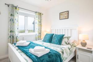 Ένα ή περισσότερα κρεβάτια σε δωμάτιο στο Ty Cuddfan