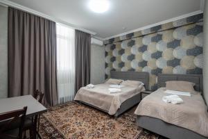 Katil atau katil-katil dalam bilik di IRIS Hotel