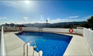 a swimming pool on the roof of a building at La vista encantada in Frigiliana