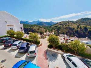 a bunch of cars parked in a parking lot at La vista encantada in Frigiliana
