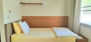 Postel nebo postele na pokoji v ubytování บ้านพิม