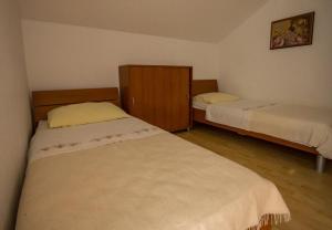 Postel nebo postele na pokoji v ubytování Apartments Daju