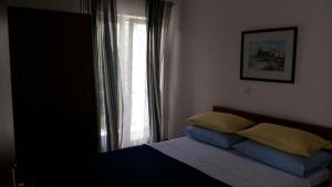 Postel nebo postele na pokoji v ubytování Apartments Daju