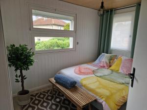 Ένα ή περισσότερα κρεβάτια σε δωμάτιο στο Maison au cœur de Tarbes