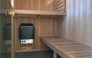 a inside of a sauna with a trash can at Three-Bedroom Holiday Home In Romo in Sønderby