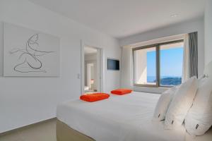 Postel nebo postele na pokoji v ubytování LIVINGHOME SUITES + 37 fotografií