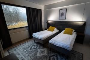 Ένα ή περισσότερα κρεβάτια σε δωμάτιο στο Arctic Raja Inn, next to Norwegian border