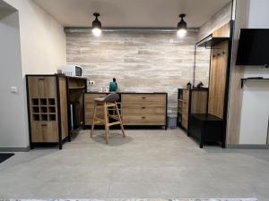 a kitchen with a counter and a chair in a room at Gabriel in Šveicarija