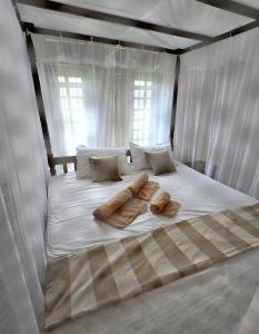 Letto o letti in una camera di Ginger Harmony Guesthouse and Cafe