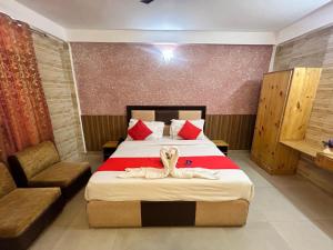 Postel nebo postele na pokoji v ubytování Hotel Redchilli