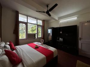 Postel nebo postele na pokoji v ubytování Hotel Redchilli