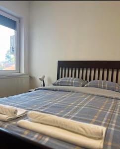Postel nebo postele na pokoji v ubytování Dekster apartmani