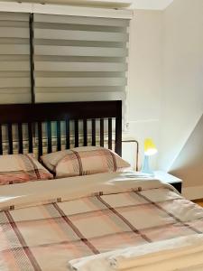Postel nebo postele na pokoji v ubytování Dekster apartmani + 28 fotografií