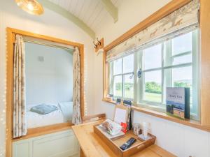 a room with a desk and a window at The Wensleydale - Uk40152 in Rathmell