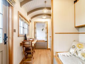 a tiny house with a desk and a window at The Swaledale Hut - Uk40151 in Rathmell