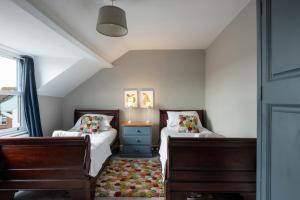 Ένα ή περισσότερα κρεβάτια σε δωμάτιο στο Hot tub & sauna, self catering house for 16 people +32 φωτογραφίες