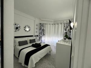 Postel nebo postele na pokoji v ubytování La casita de Omar en el corazón del Puerto de la Cruz