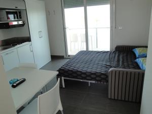 Postel nebo postele na pokoji v ubytování Residence La Nave