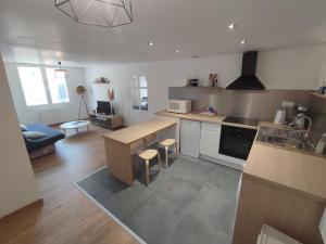 a kitchen with a sink and a counter top at Appartement T2 centre de Lourdes in Lourdes