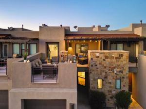 a view of a house with a patio at Stargazer – Luxury Condo, Rooftop Views, Private Hot Tub in St. George