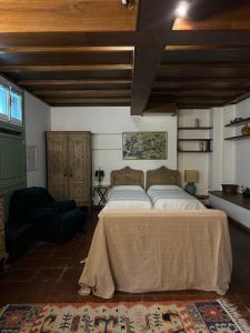 a bedroom with a large bed in a room at Cassini Home in Turin