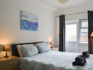a bedroom with a bed and a window at Apartment 1 - Uk44165 in Bridlington +12 photos