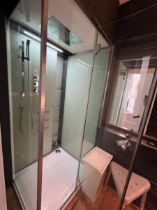 a shower with a glass door in a bathroom at Casa Mellow in Ghent +4 photos