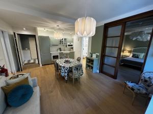 a living room with a table and a couch at Casa dì in Florence +14 photos