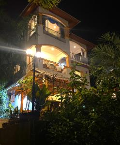 a large building with a balcony at night at EXCLUSIVE VILLA, four or five bedrooms in Karon Beach +51 photos