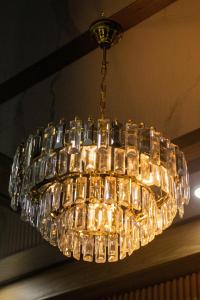 a glass chandelier hanging from a ceiling at Hotel Mall plaza in Santa Marta