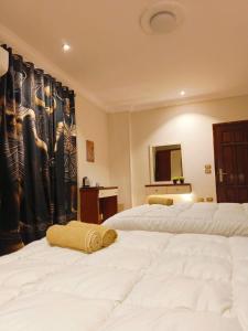 Voodi või voodid majutusasutuse Akh Pyramid Hostel toas