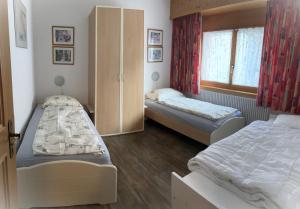 Postel nebo postele na pokoji v ubytování Residenz Darianne Leukerbad