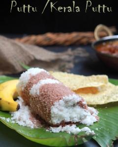 a piece of cake on a green plate with a banana at Emma Homestay in Pattiyūrgrāmam