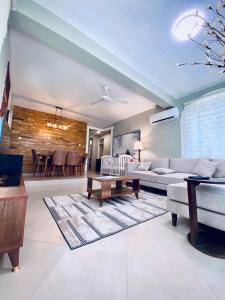 a living room with a couch and a table at Jacomo Residences in Dar es Salaam