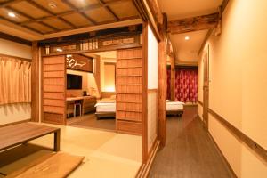 Postel nebo postele na pokoji v ubytování 都電屋 TodenHotel + 37 fotografií