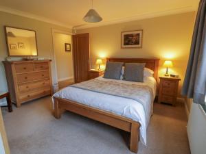 Postel nebo postele na pokoji v ubytování The Stables at Daldorch + 10 fotografií