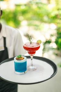 a drink in a glass on a table at Kisiwa on the Beach in Paje