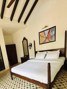 Postel nebo postele na pokoji v ubytování The Rose Goa Beach Resort