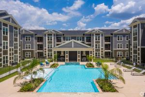 an image of an apartment complex with a swimming pool at Cullen 4307 I Parking I Pool I Gym I 2bd2bth in Houston