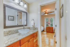 a bathroom with a sink and a mirror at Blue Hawaii House in Princeville +88 photos