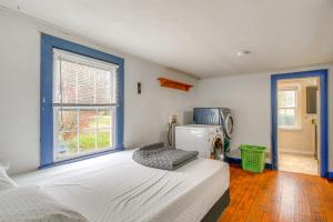 a bedroom with a white bed and a window at 5 Mi to Lake Ontario Mexico Home with Seasonal Pool in Mexico